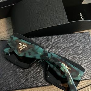 Only accepting full offers. Already a big discount. Never worn Prada symbole